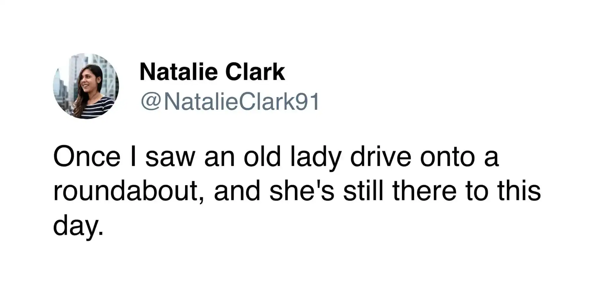 An elderly woman driving onto a roundabout, still present today.