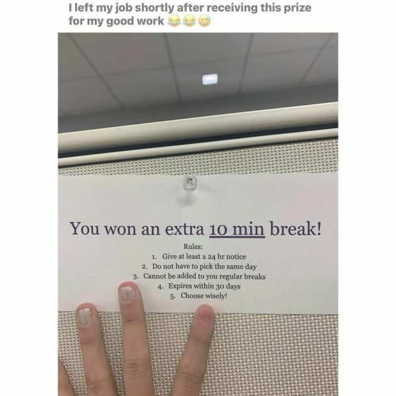 10-minute break notice with rules for taking extra breaks, posted on a wall with a person's fingers.