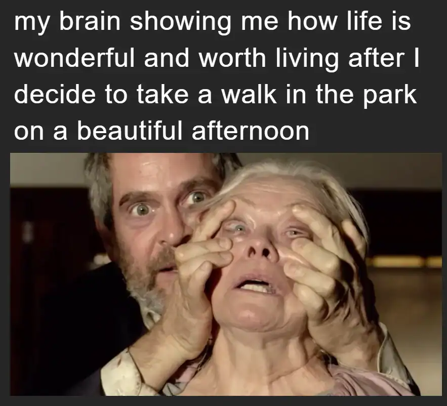 Man holding elderly woman's face with both hands, making a funny face.