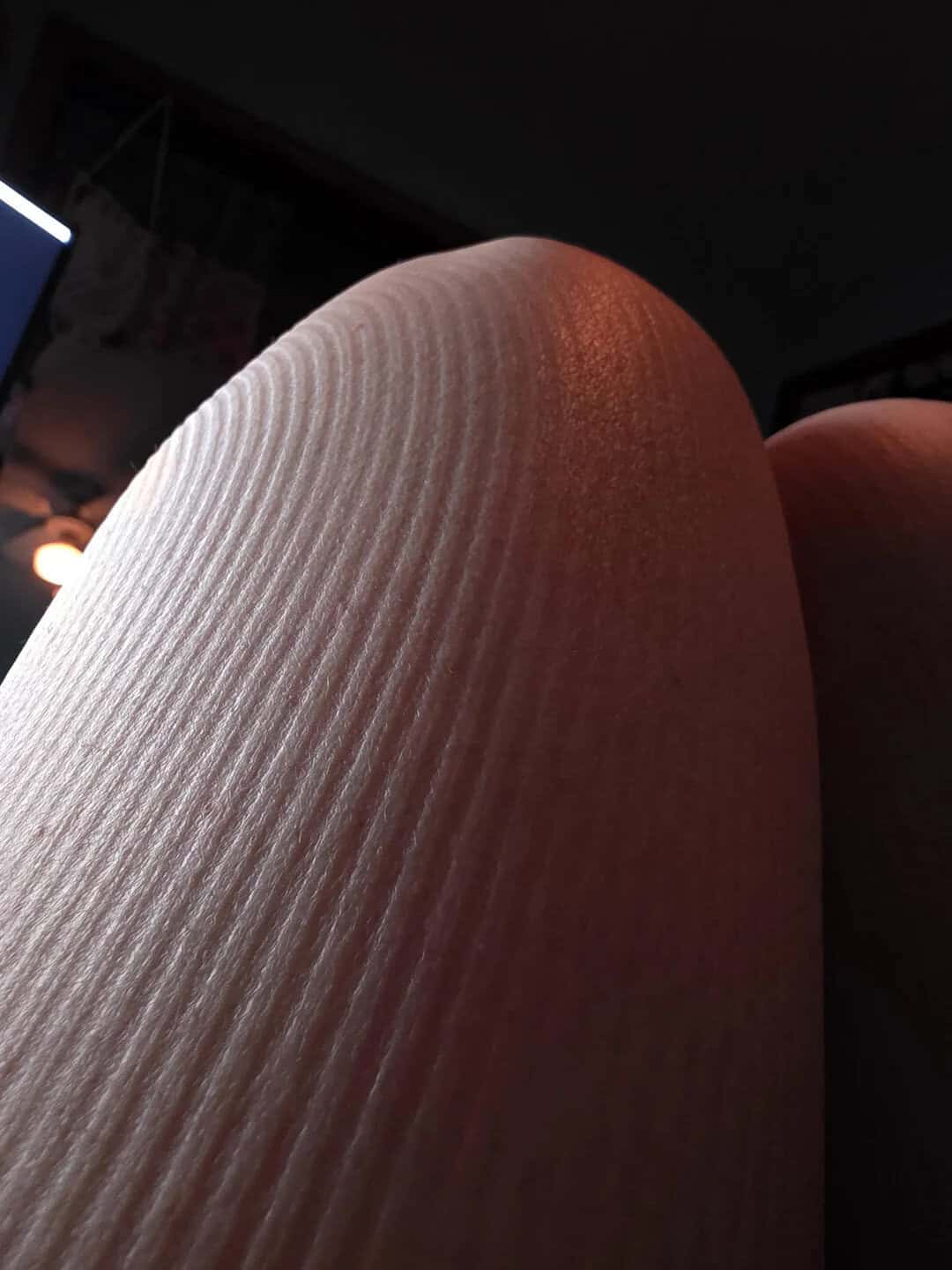 Close-up of a textured fabric surface with diagonal lines.