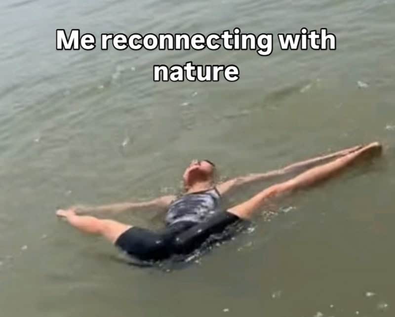 Person floating on water with text 'Me reconnecting with nature'.