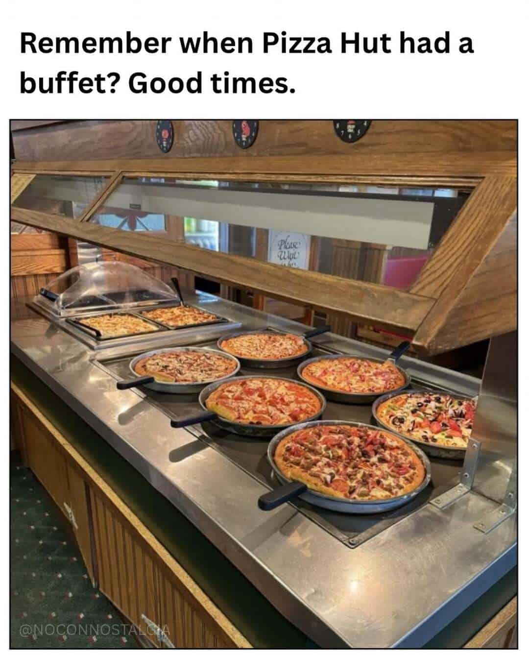 Pizza buffet at Pizza Hut with various pizzas on display.