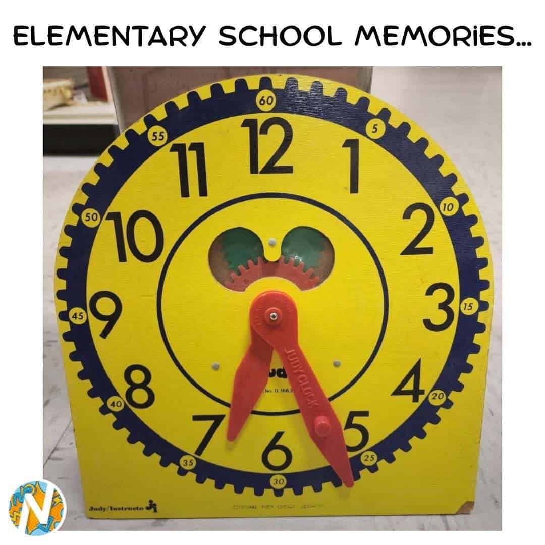 Yellow clock with black numbers and red hands, labeled 'Elementary School Memories' at top.