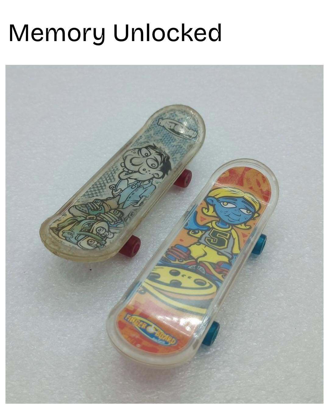 Two skateboard decks with cartoon characters and the text 'Memory Unlocked' above.