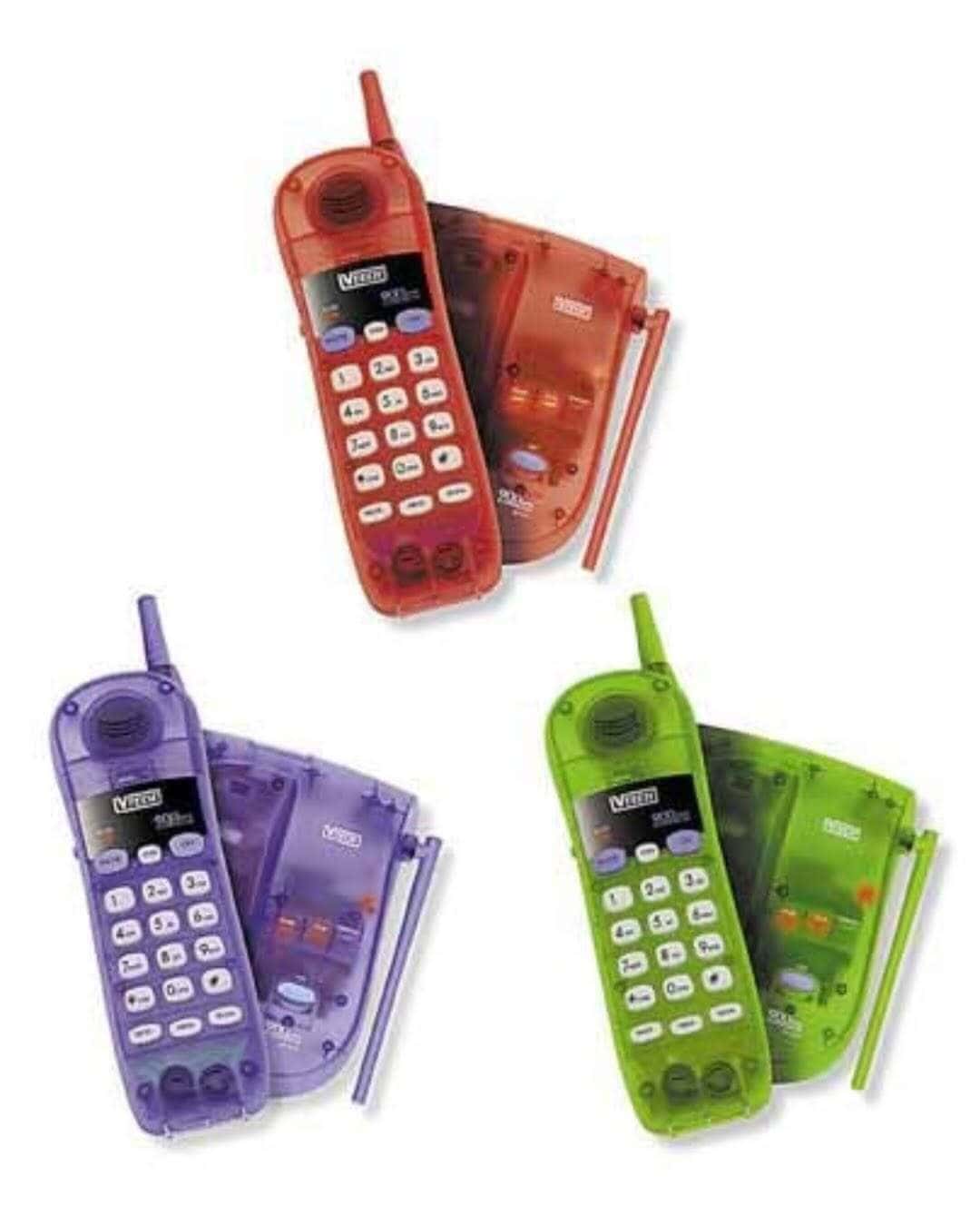 Colorful vintage Nokia phones with transparent cases and matching pens.