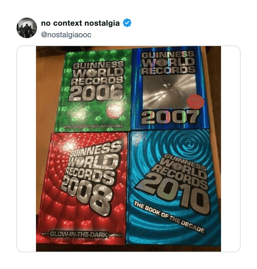 Guinness World Records 2006, 2007, 2008, and 2010 books displayed on a table.