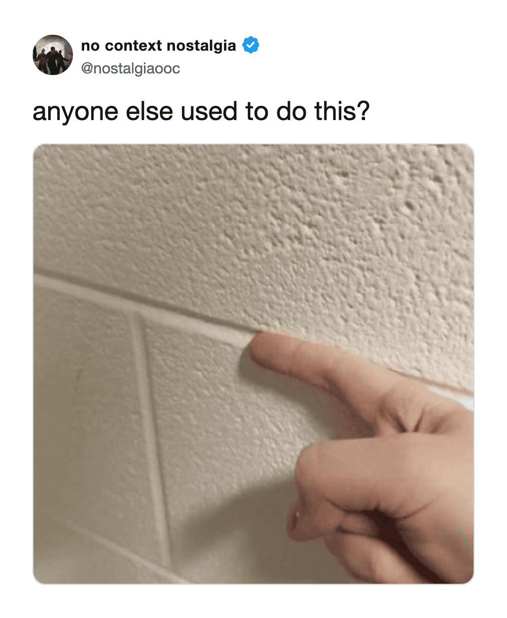 A person pointing at a line on a textured wall, questioning if others have done this.