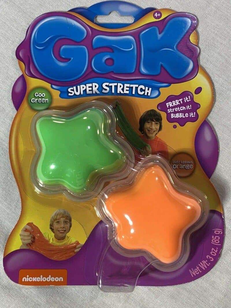 Gak Super Stretch toy in green and orange, in packaging with children images.