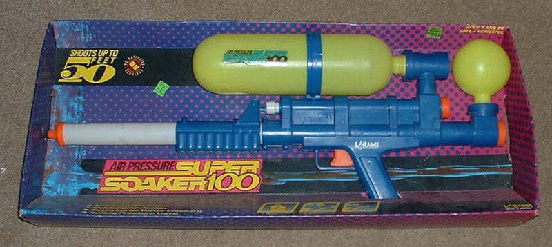 Vintage Super Soaker 100 water gun with yellow tank and blue body.