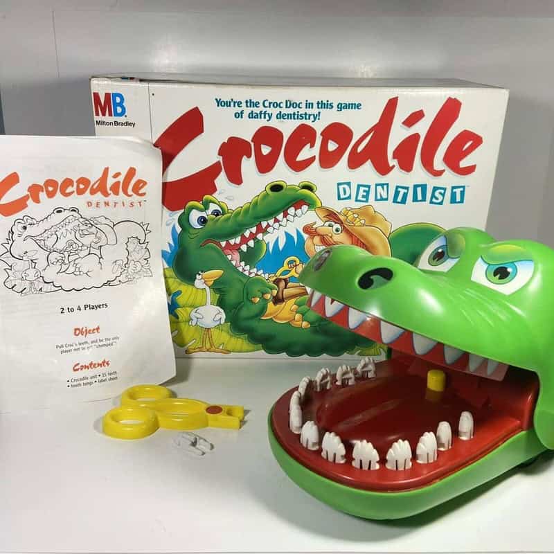 Crocodile Dentist game with box, crocodile mouth toy, and yellow key.