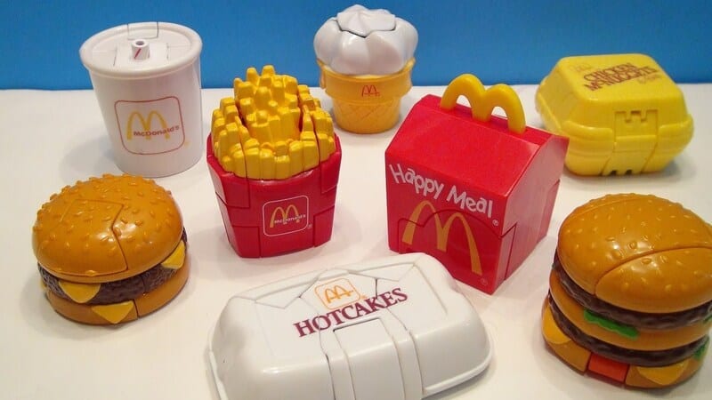 Collection of McDonald's toy food items from the 90s, including burgers, fries, and drinks.