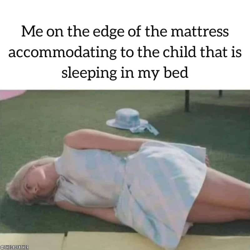 Woman lying on edge of bed with child sleeping in her bed, caption about parenting.