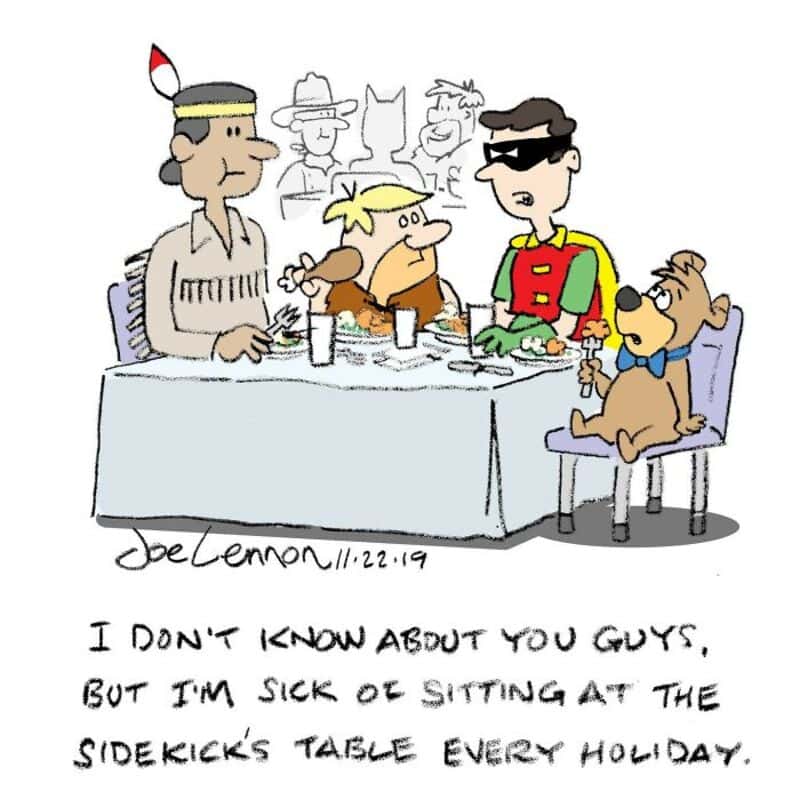 Peanuts characters at a holiday table with handwritten note about sitting at the sidekicks table.