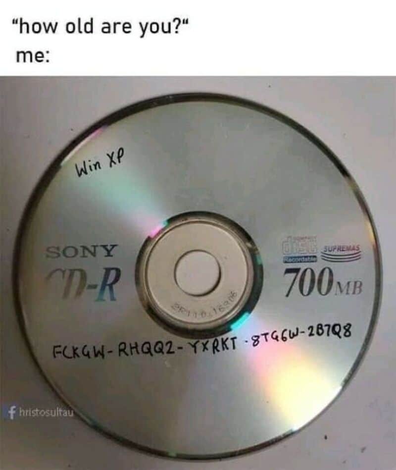 CD labeled 'Win XP' with handwritten code, referencing old technology and software.