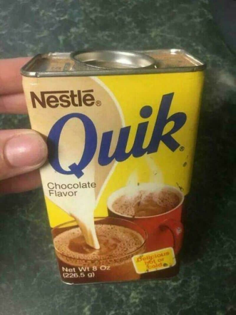 Nestlé Quik chocolate flavor powder in a yellow box with a pouring image.