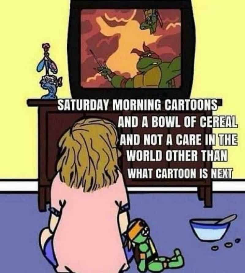 Child watching TV with Teenage Mutant Ninja Turtles cartoon, cereal bowl and toys nearby.