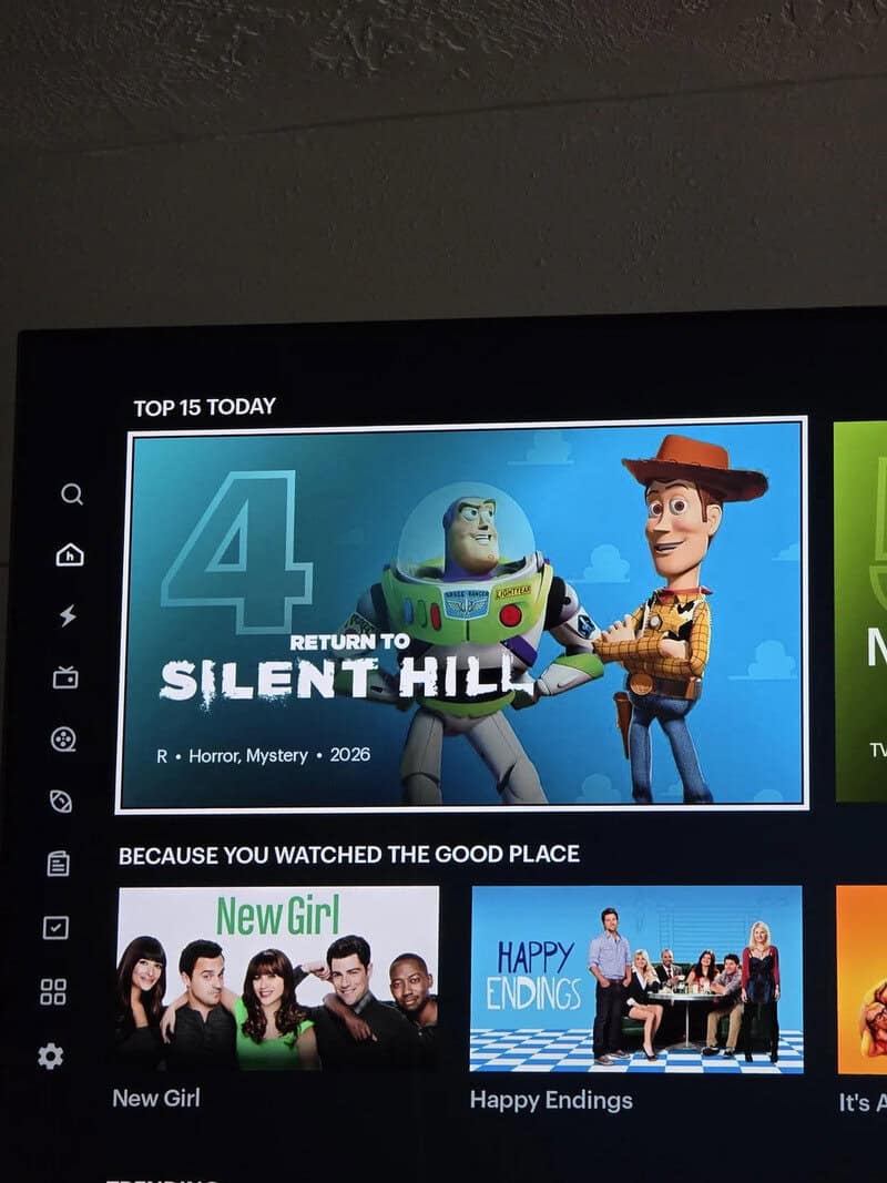 TV screen showing 'Return to Silent Hill' and characters Buzz Lightyear and Sheriff Woody.