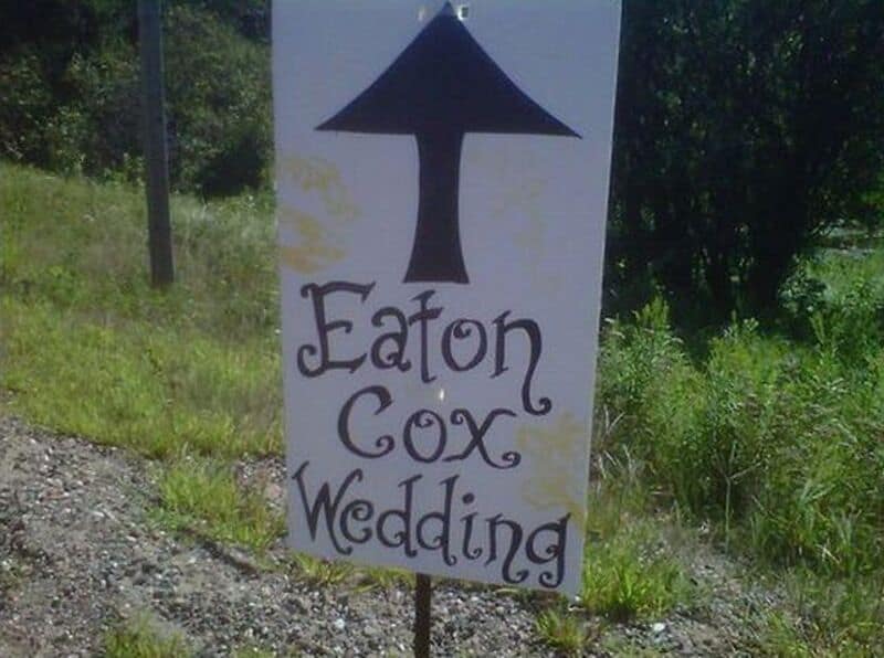 Sign with an arrow pointing up, reading 'Eaton Cox Wedding'.