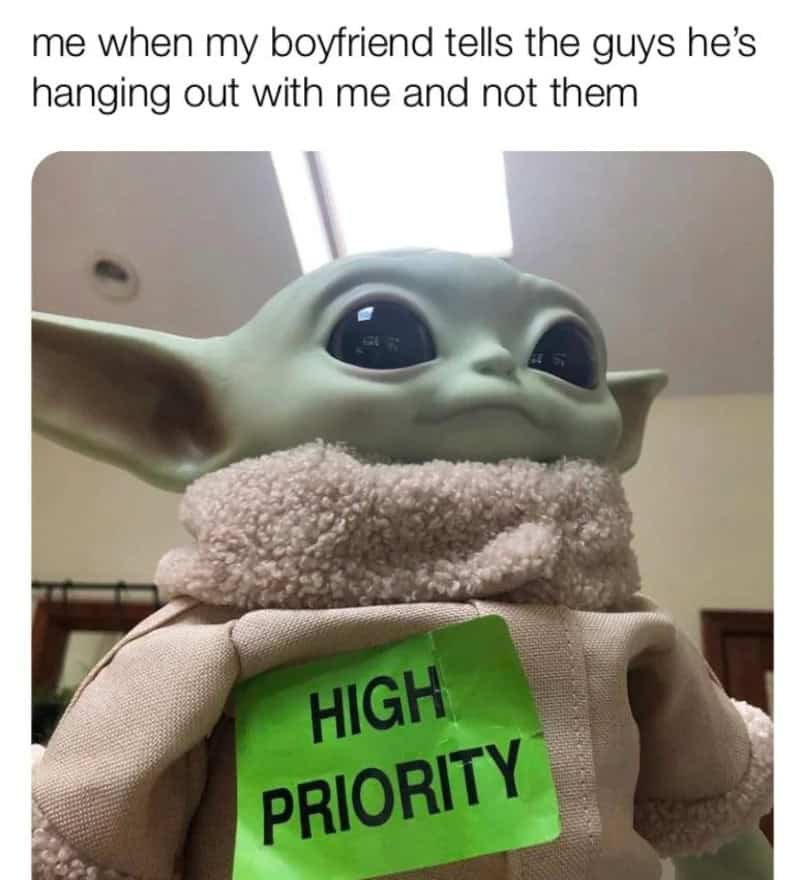 Baby Yoda with a 'High Priority' sign, caption about boyfriend hanging out with other guys.