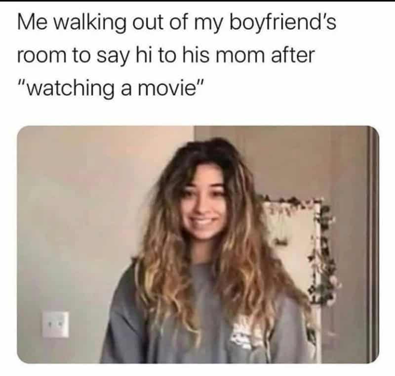 Young woman walking out of her boyfriend's room to tell his mom she was watching a movie.