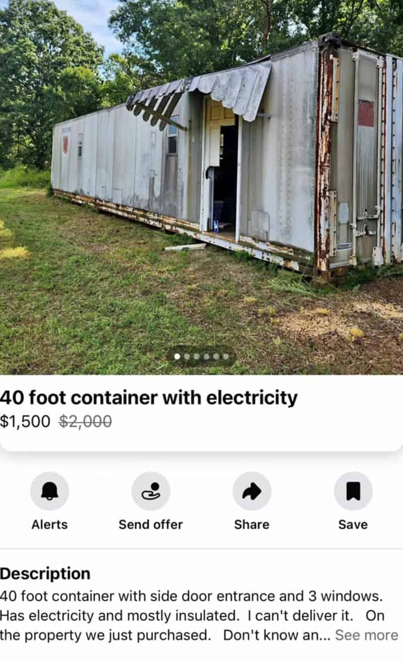 40 foot container with electricity, side door entrance, and 3 windows, on grassy area with trees in.
