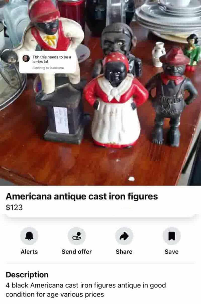 Antique black cast iron figurines of African American characters on a wooden surface.