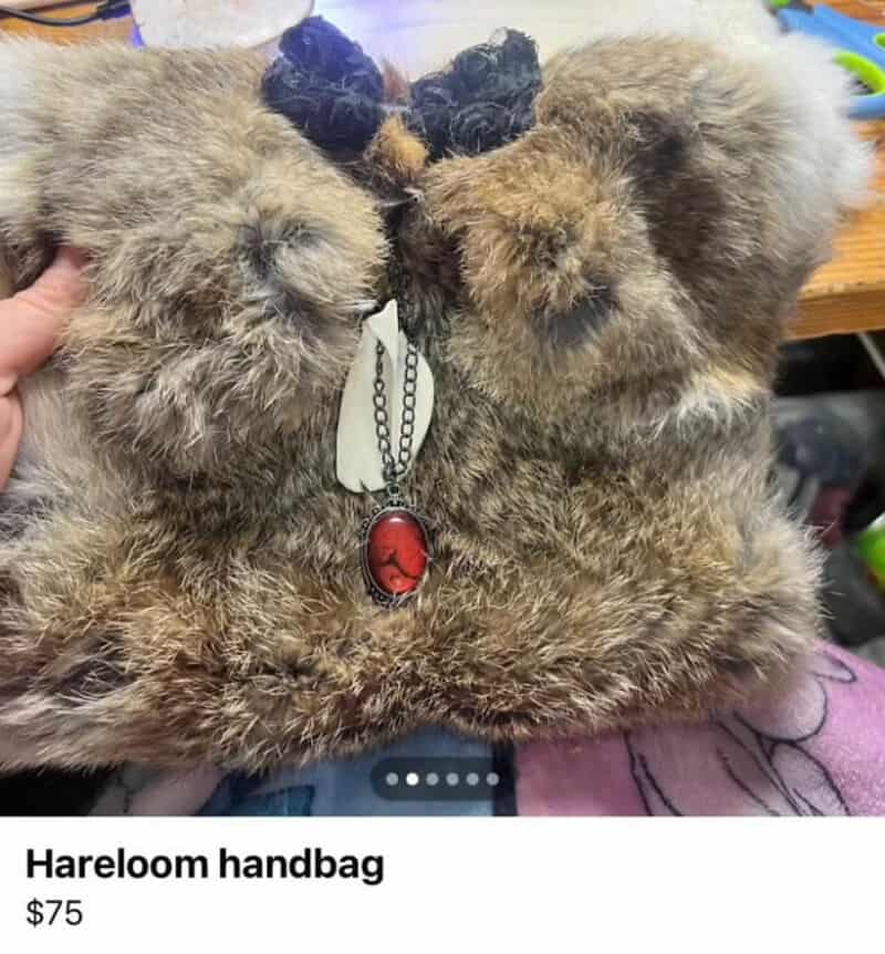 Fur handbag with necklace and black bow, priced at $75.