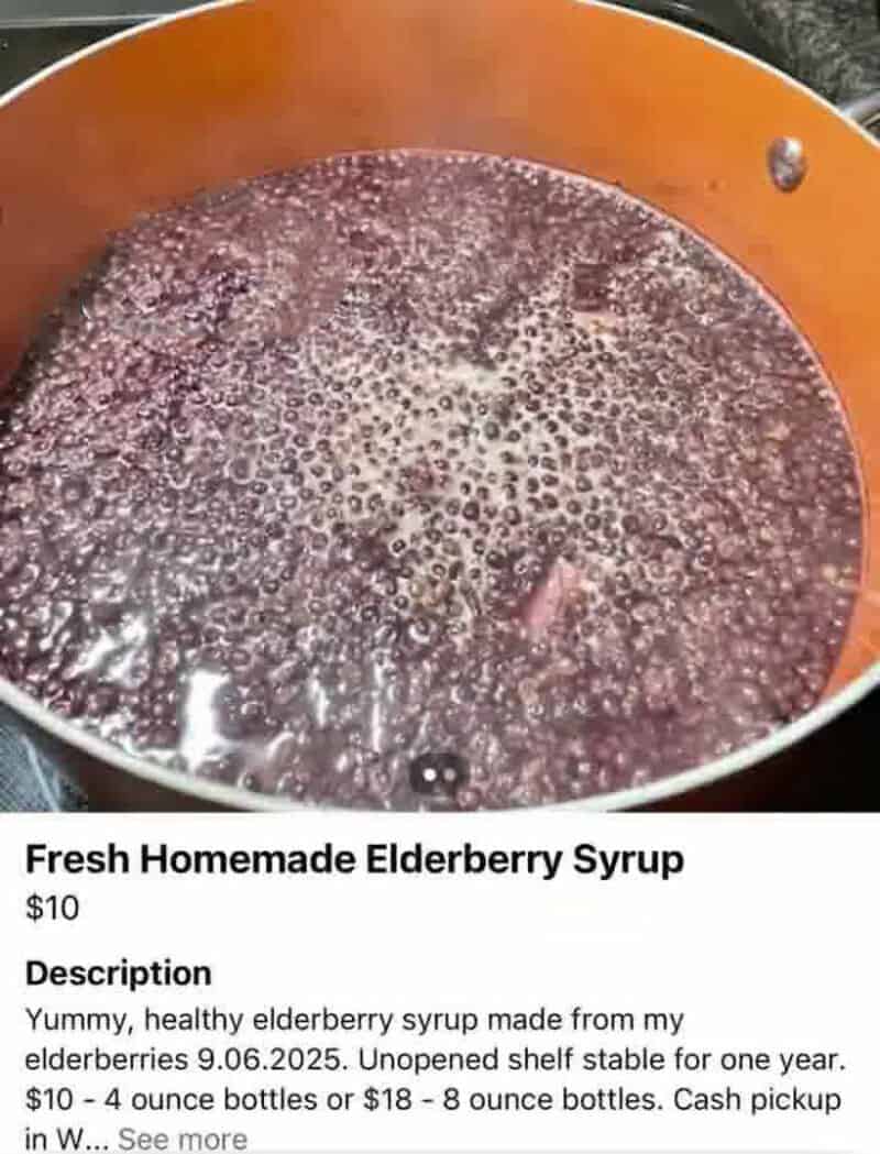 Fresh homemade elderberry syrup in a pot, ready for use.