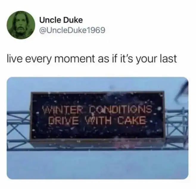 "Winter Conditions Drive With Cake" digital sign on a highway overpass.