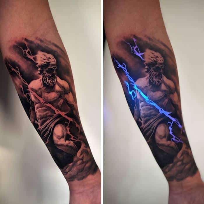 Tattoo of a muscular man with a lightning bolt, shown under UV light.