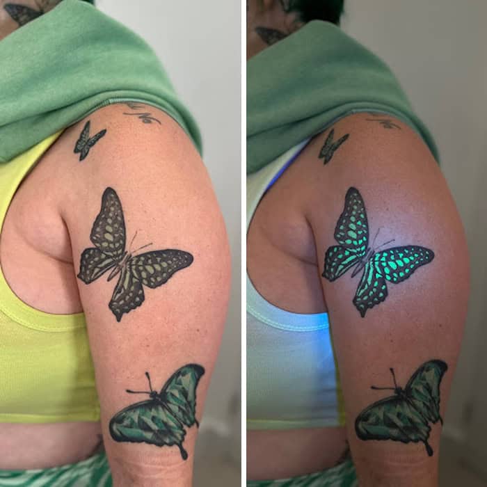 Tattoo of a butterfly and moth under UV light on person's arm.