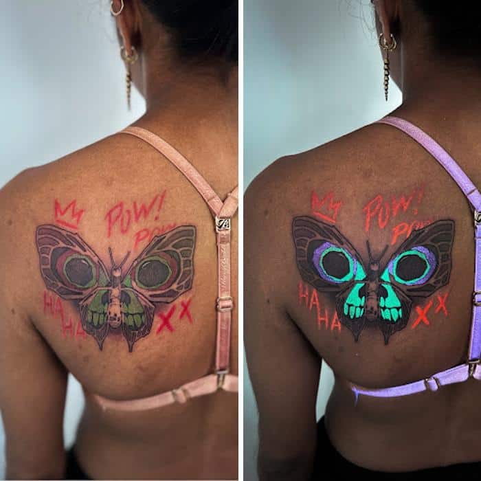 Tattoo of a butterfly with glow-in-the-dark ink on a woman's shoulder blade.