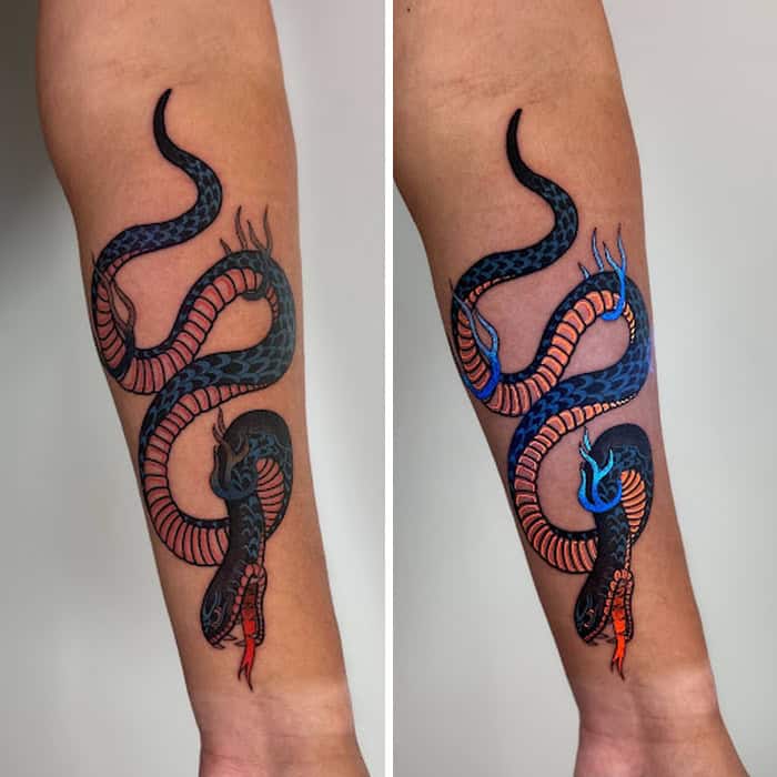 Colorful snake tattoo with UV-reactive ink on forearm.