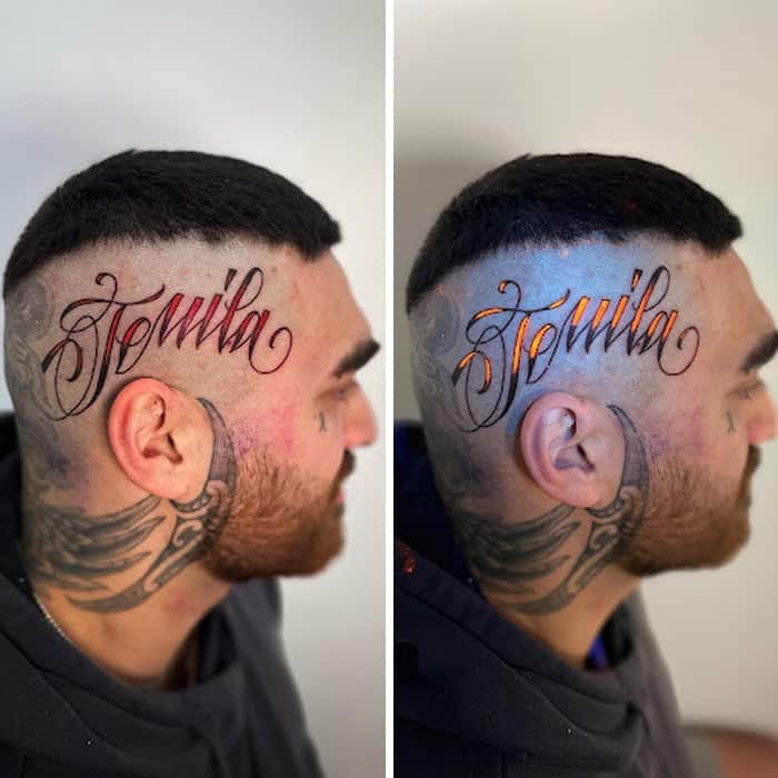 Tattoo of the name 'Hernia' in elegant script on man's side head and neck.