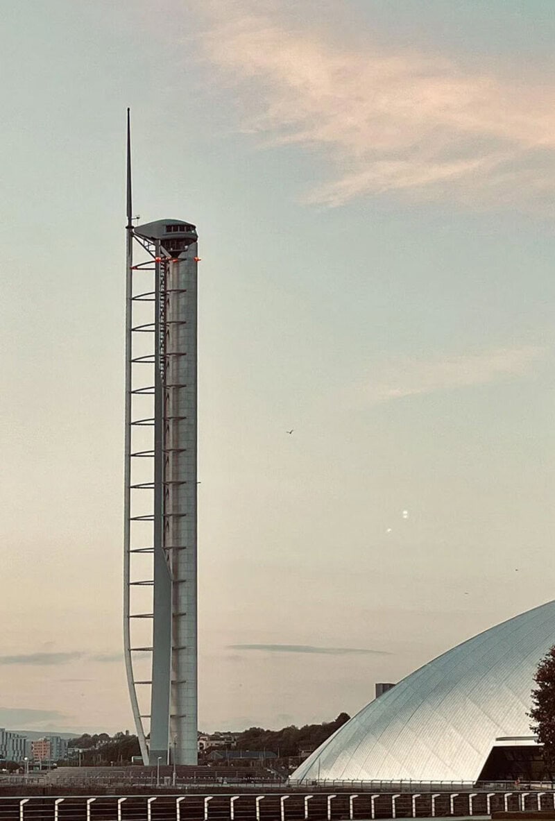 Tall tower with a narrow, elongated structure and a small observation deck at the top.