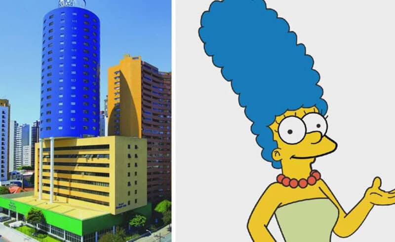Bright cityscape with colorful buildings and a cartoon character from The Simpsons.