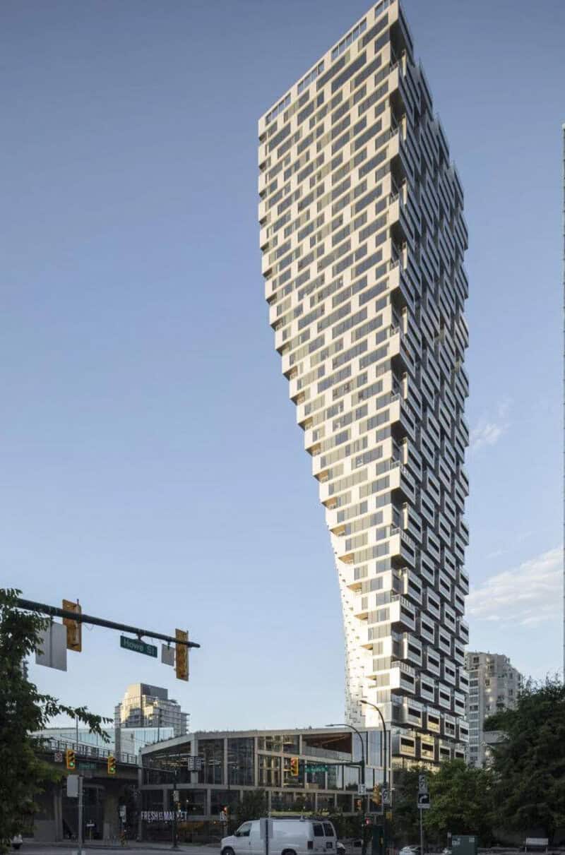 High-rise building with a unique twisting design against a blue sky.