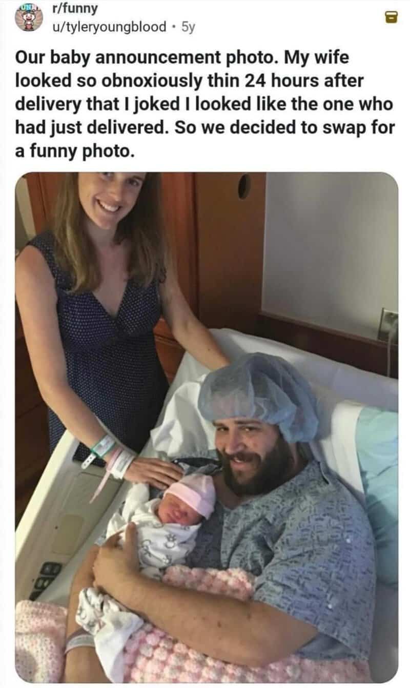 A woman and man in a hospital room holding a newborn baby, woman smiling.