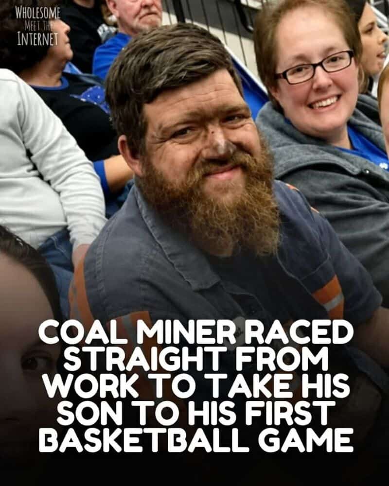 Coal miner with beard smiling at his son's first basketball game.