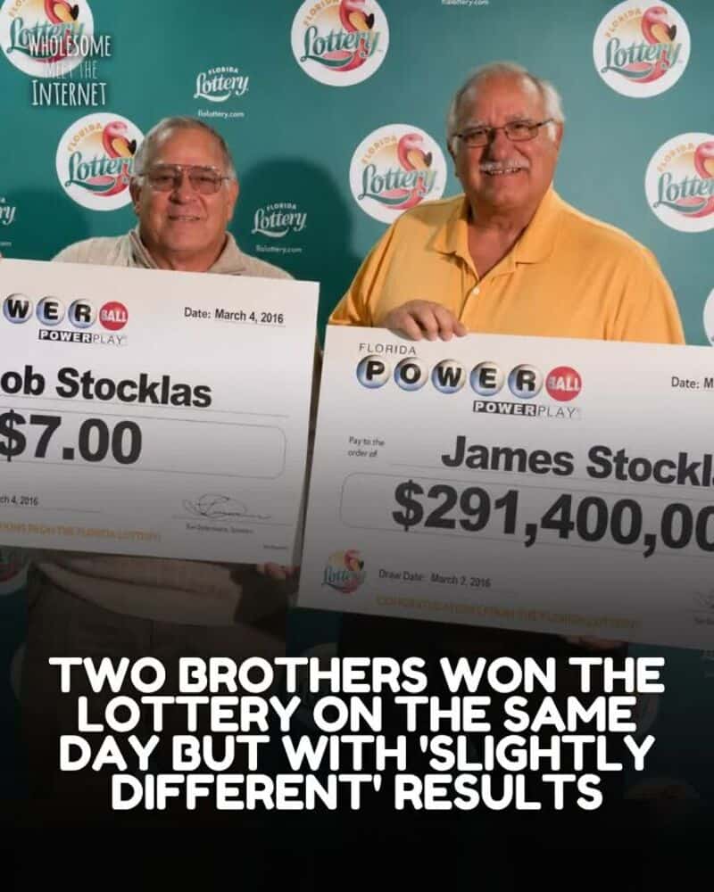 Two brothers holding large lottery checks, smiling, with a lottery backdrop.