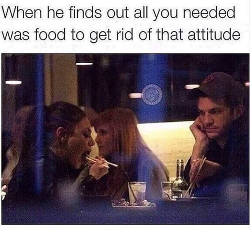Two women eating with a man sitting across from them at a restaurant, with the caption about food an.