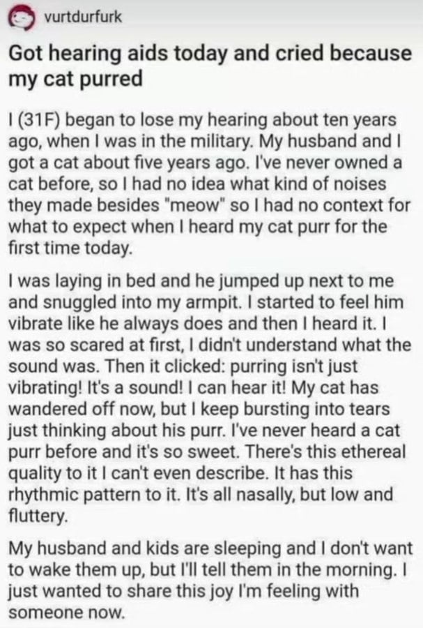 A woman with hearing aids crying after her cat purred, sharing her emotional experience.