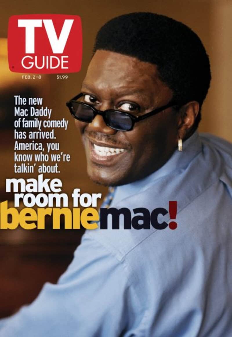TV Guide cover featuring a man with glasses and a big smile, wearing a blue shirt.