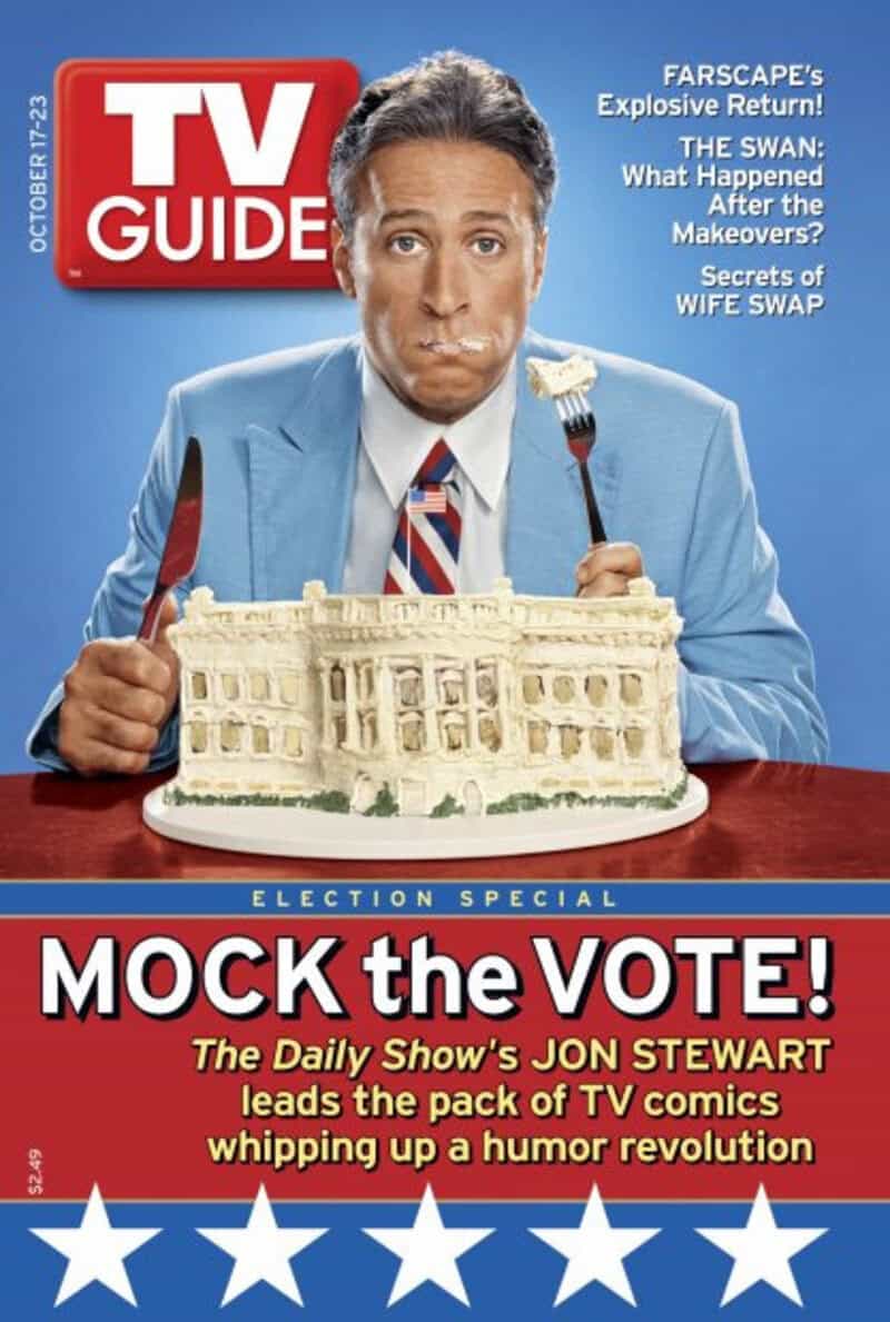 TV Guide cover with a man in a blue suit holding a cake of the White House.