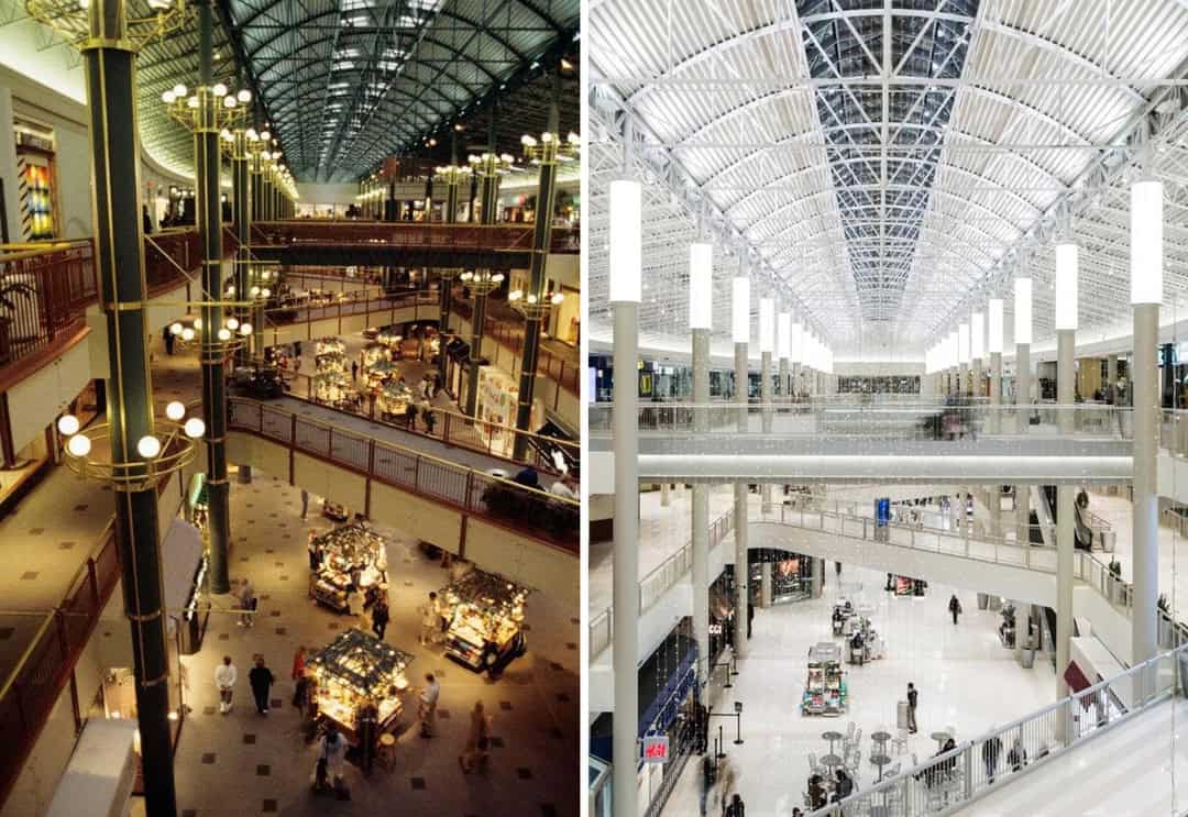 Vintage shopping mall interior with ornate lighting and multiple levels.