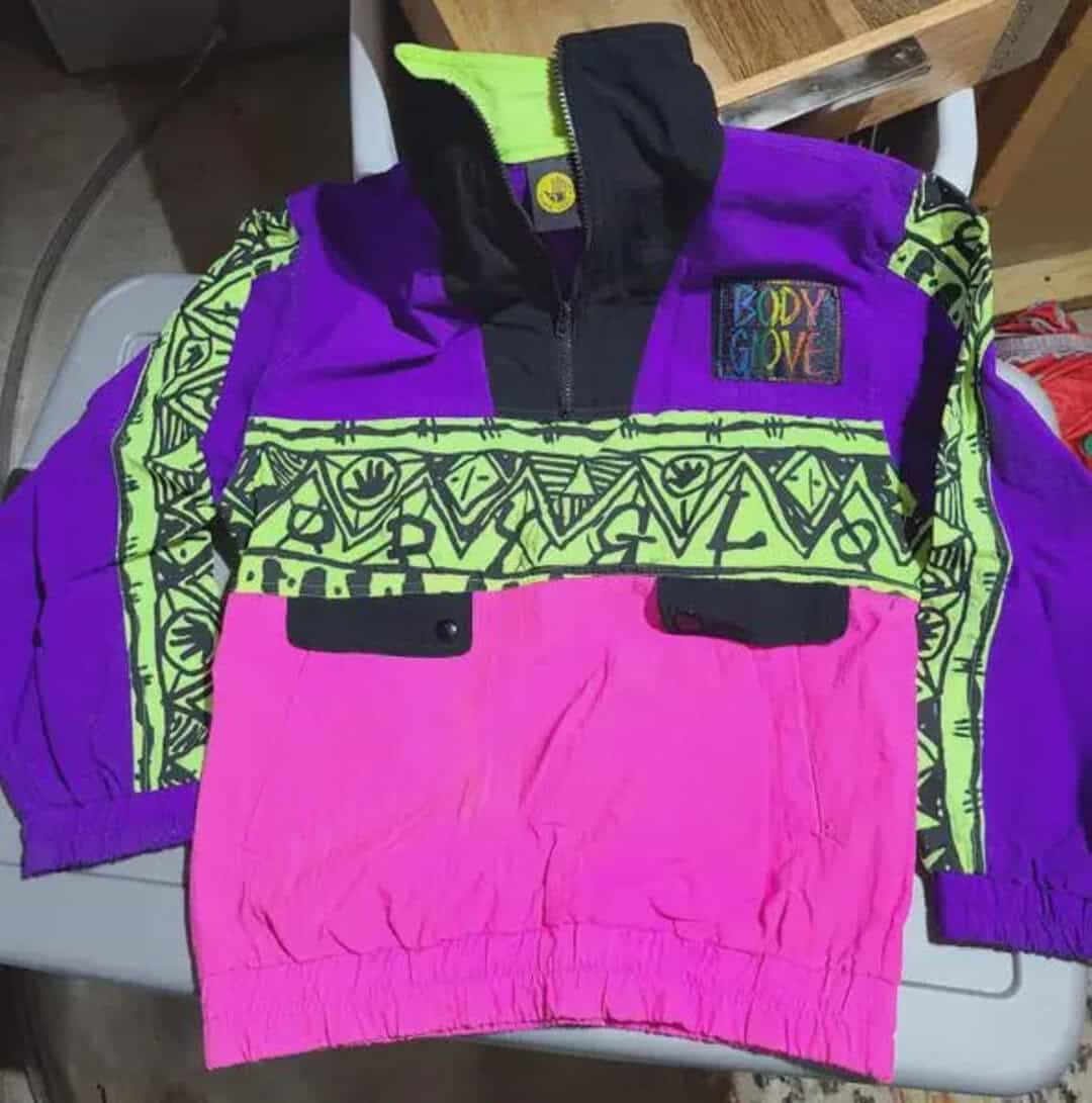 Colorful 90s-style windbreaker with neon pink, purple, and green patterns.