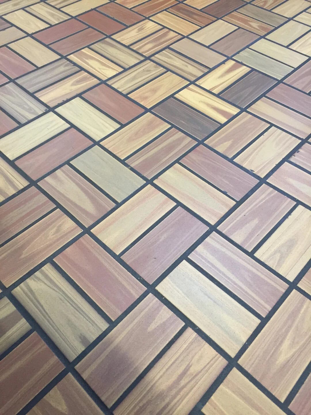 Colorful tiled floor with geometric pattern from 90s design.