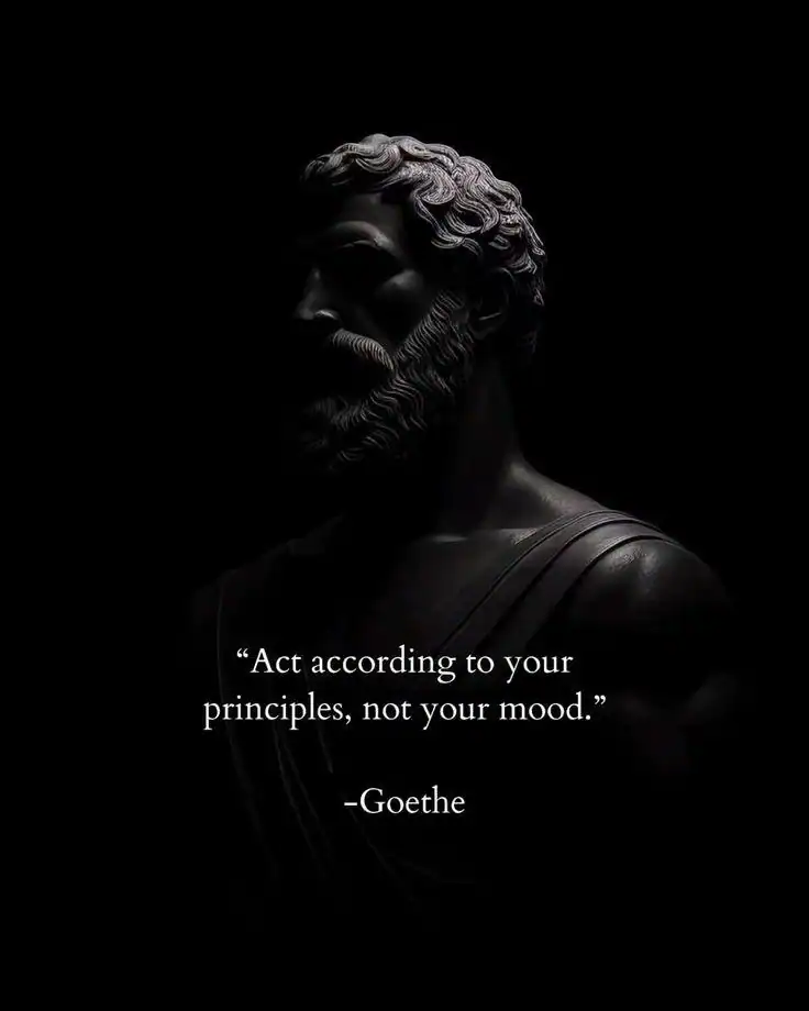Statue of a bearded man with a quote by Goethe about acting according to principles.