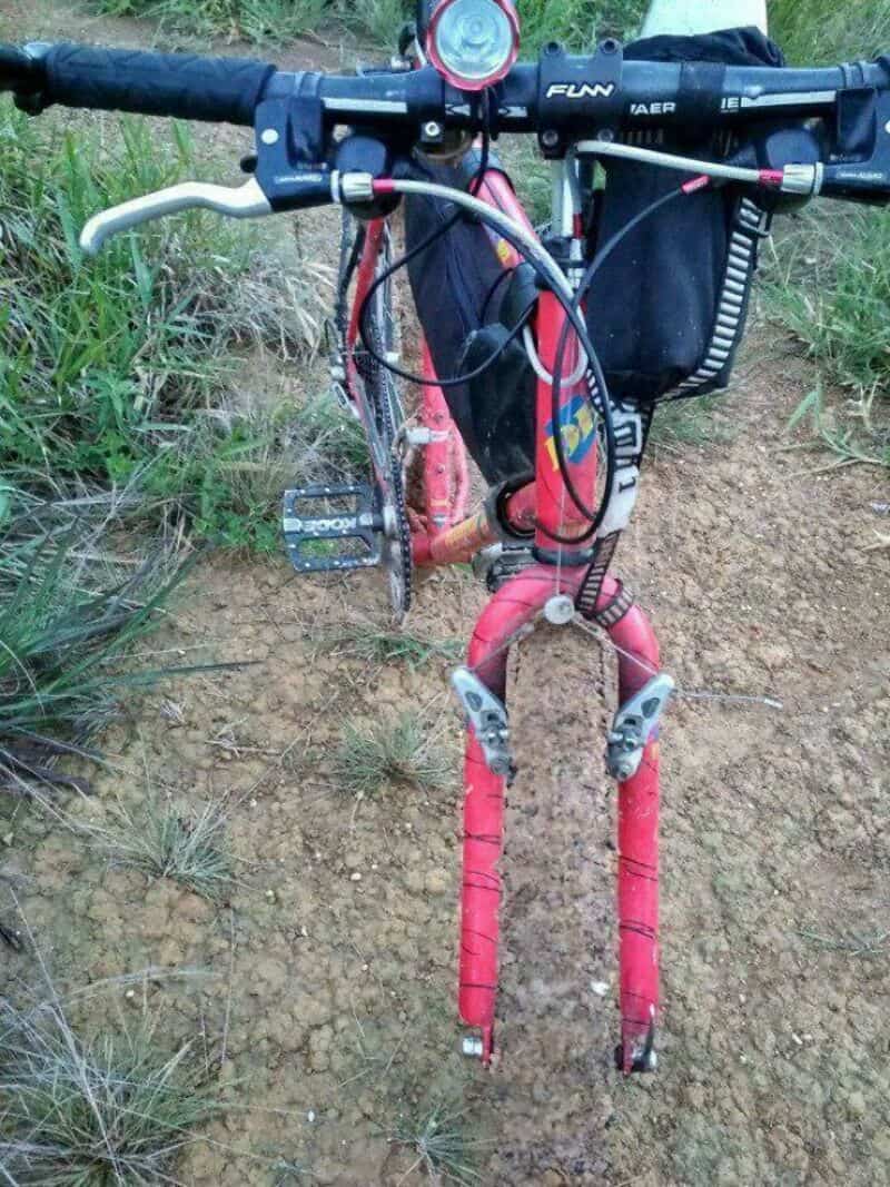 Bike with front fork missing, showing the frame and handlebars.