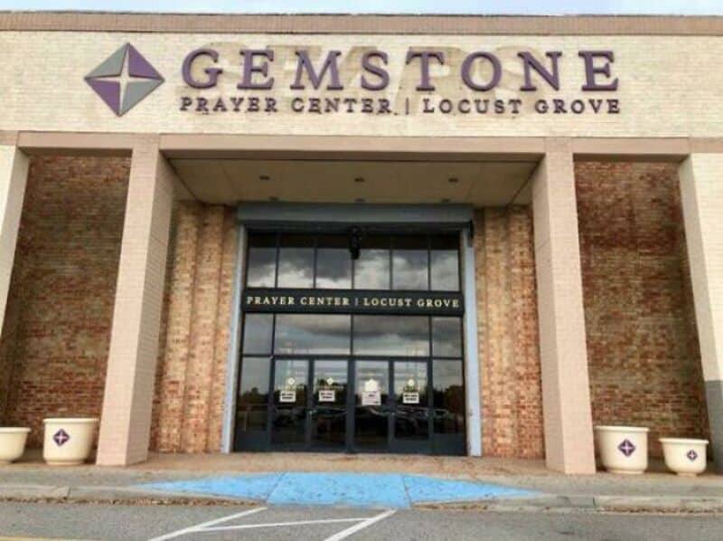 Gemstone Prayer Center, Locust Grove, with glass doors and brick walls.